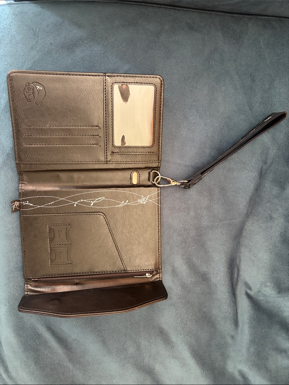 TNT RAyan Black Embossed Leather Passport Wallet with Signature Logo - Picture 8 of 10